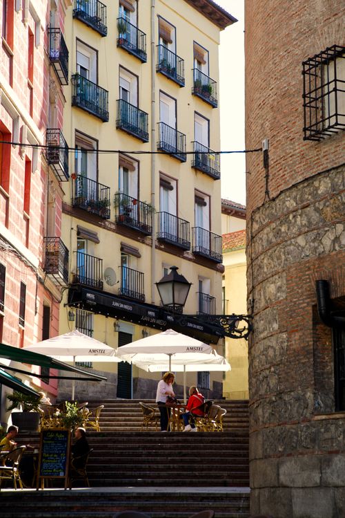 Free A quaint cafe in Madrid's old town with historic architecture and lively atmosphere. Stock Photo