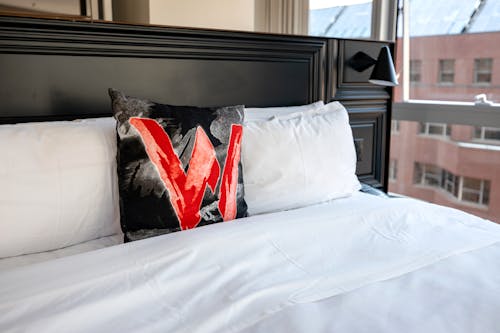 Free White and Red Pillows on the Bed Stock Photo