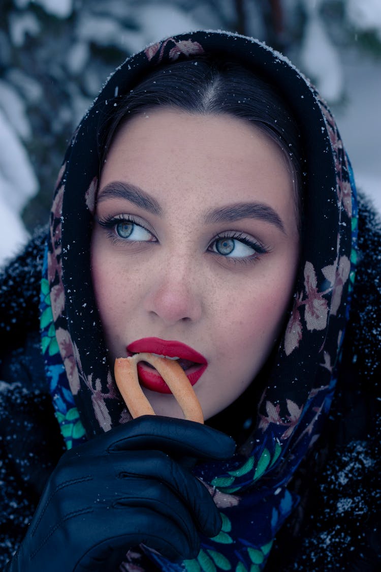 Woman Eating In Winter