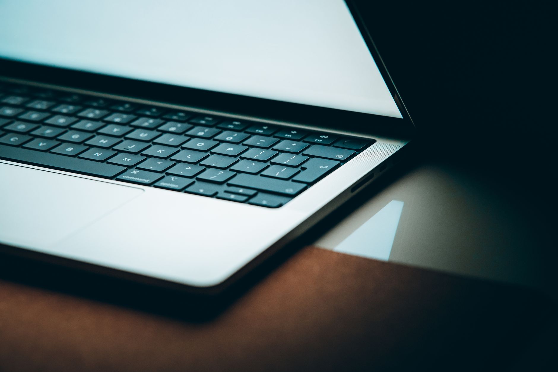 Close-up of a modern laptop keyboard with a backlit display, emphasizing sleek design.