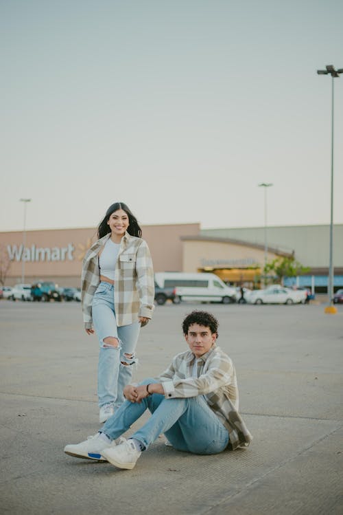 Free Man and Woman Smiling at Walmart Car Park Stock Photo