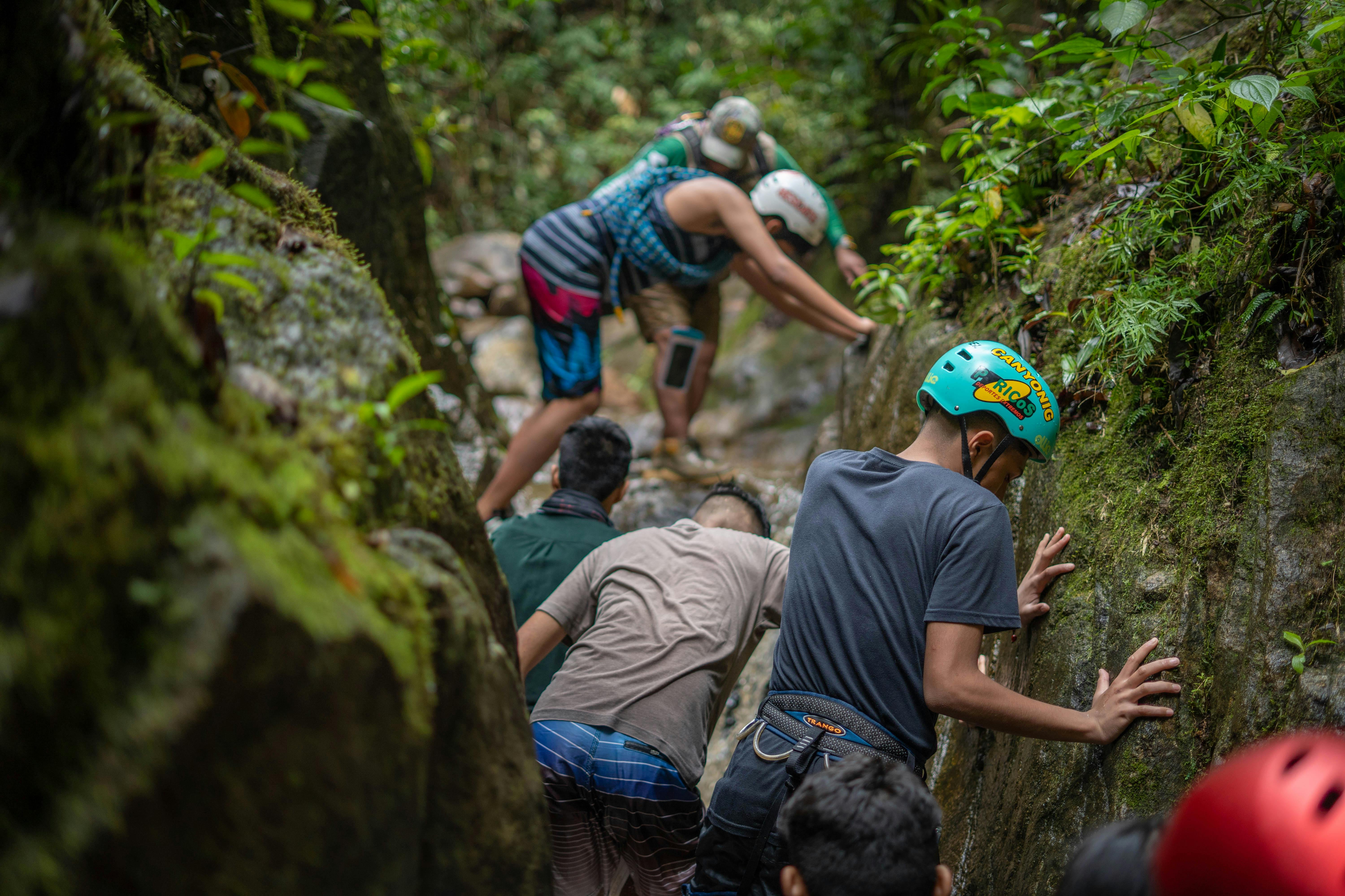 Free Group of hikers traversing rugged rocks in Peru, showcasing adventure and teamwork