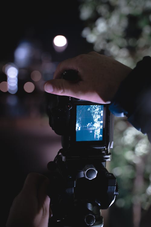 Selective Focus of a Person Holding a Camera
