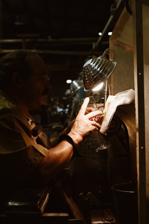 Man Fixing Industrial Machine