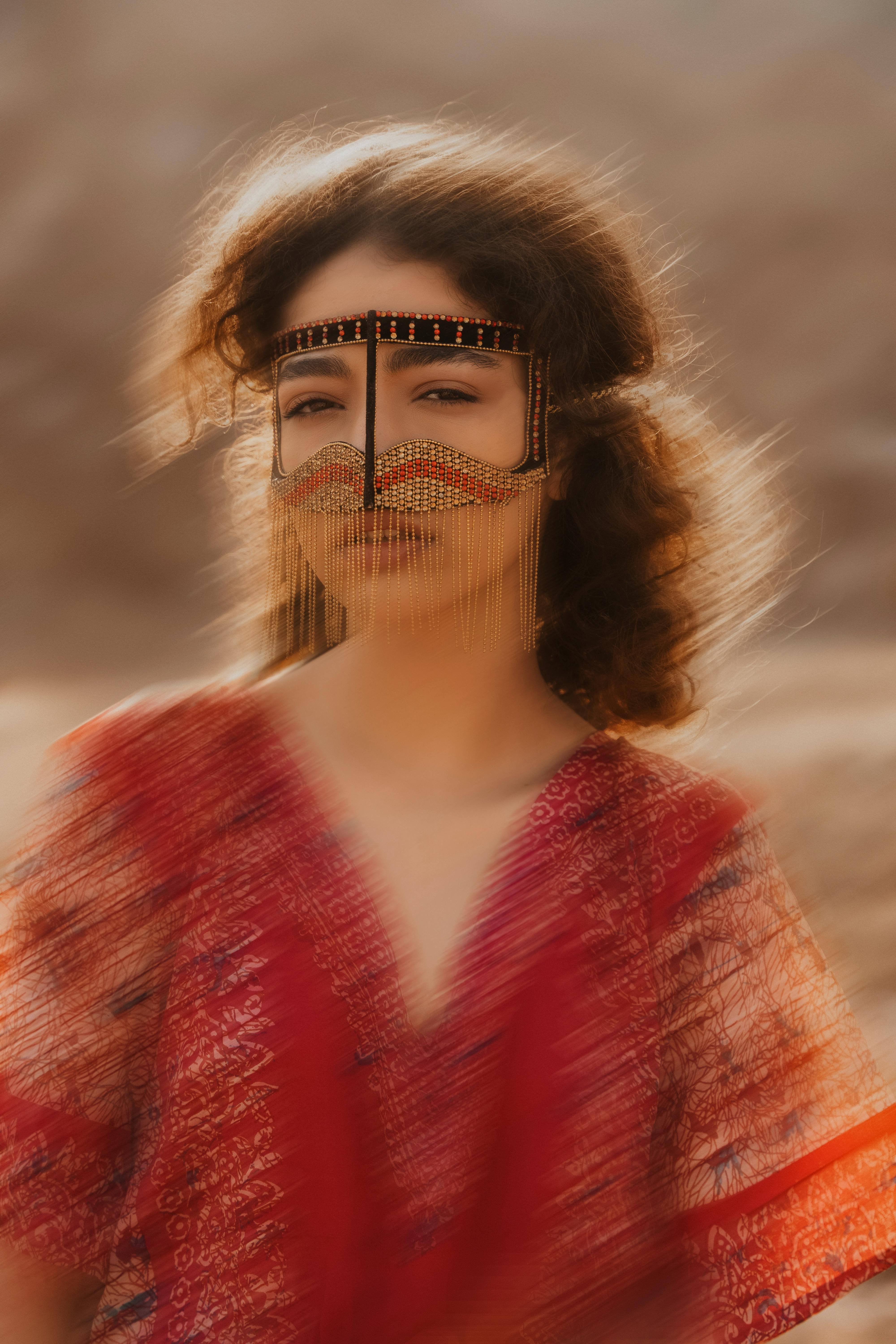 Blurred motion photograph of a woman in traditional Middle Eastern attire, showcasing cultural beauty.