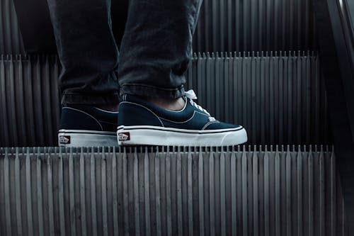 Man Feet in Sneakers on Elevator