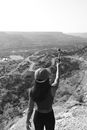 Woman in Black Tank Top Holding Camera