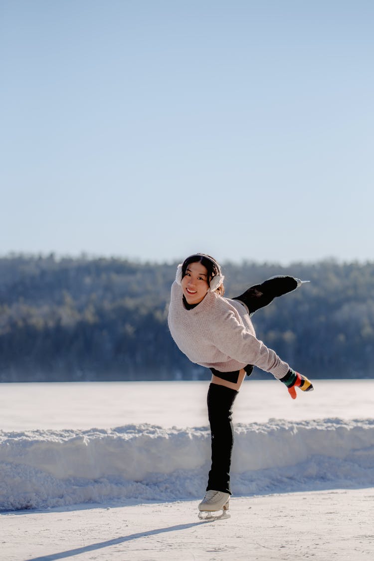 Woman Smiling And Ice Skating