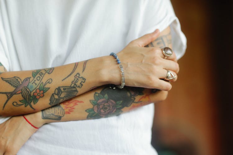 Close Up Of Tattoos On Arms