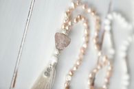 Beads Necklace on White Surface