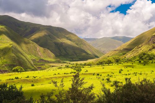 Free Beautiful green valley with hills and clouds in Salta, Argentina. Stock Photo