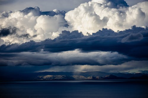 Free White Clouds over Blue Sea Stock Photo