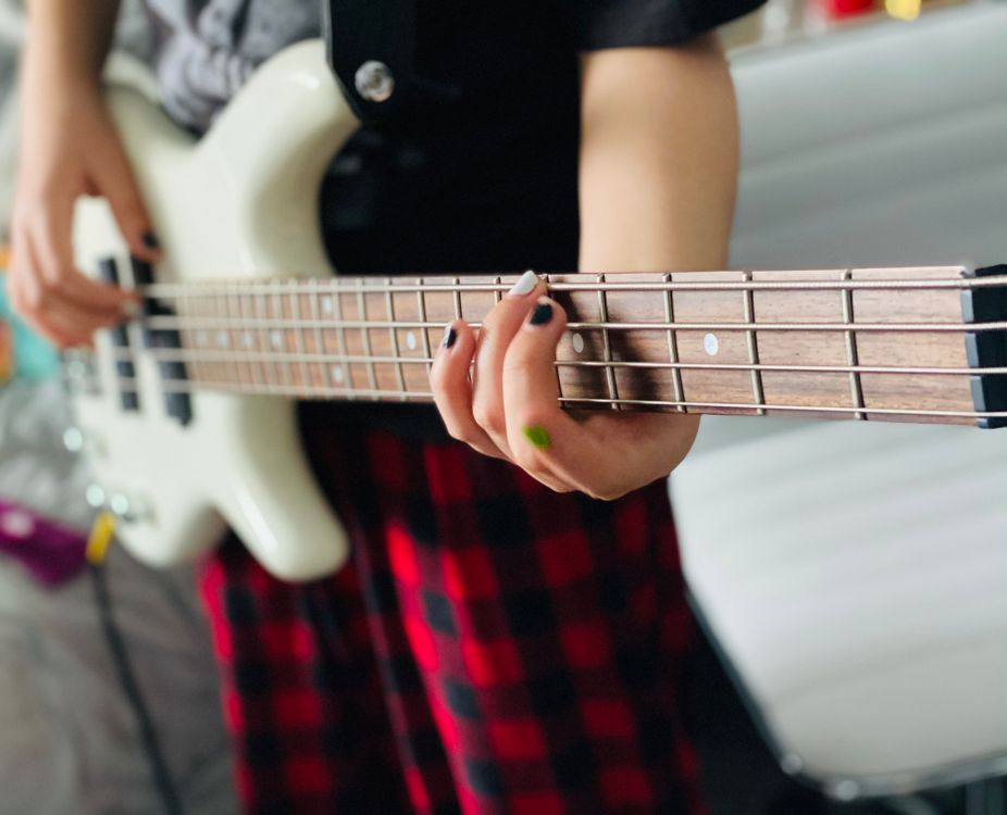 A Person Playing the Bass Guitar · Free Stock Photo
