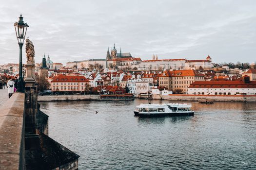 Charles Bridge at sunrise with a photographer — Prague