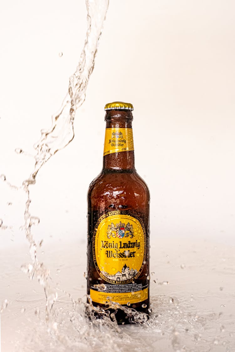 Water Splashing Around A Bottle Of Beer