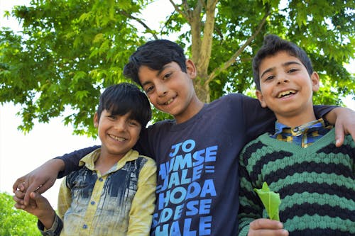 A Low Angle Shot of Young Boys Smiling