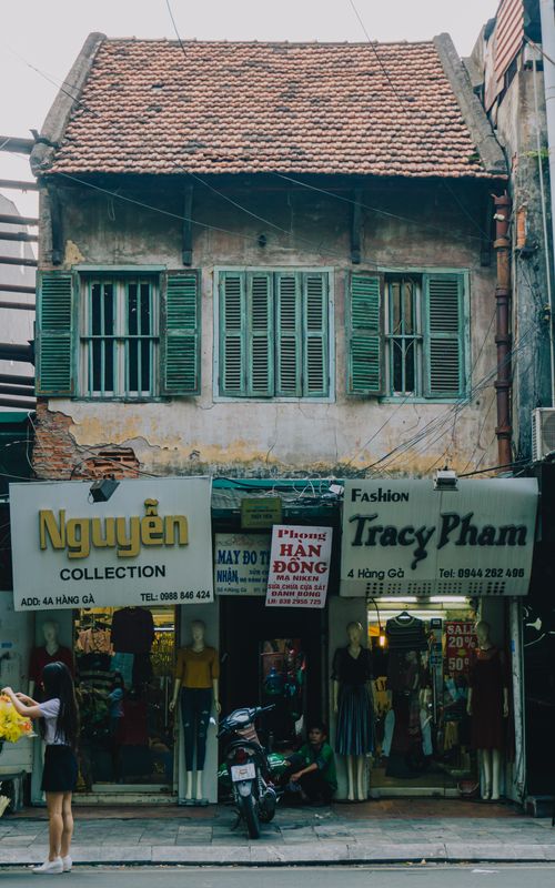 Free Charming old-style boutiques on a bustling street in Hanoi, Vietnam. Stock Photo
