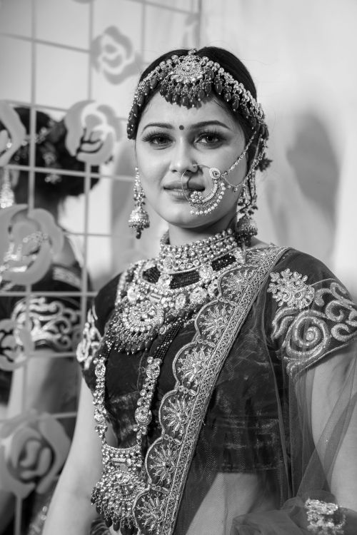 Free Stunning traditional bridal portrait in intricate attire with detailed jewelry, captured indoors. Stock Photo