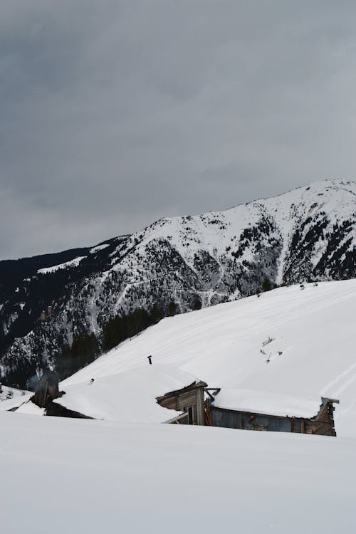 Village in Mountains under Snow