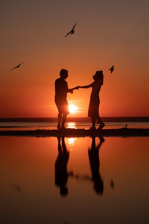 Silhouette of a Couple Dancing Together