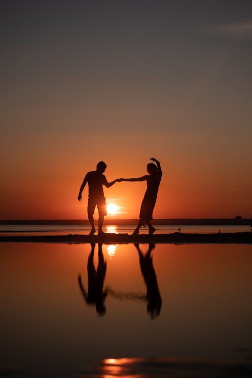 A Couple Dancing During Sunset
