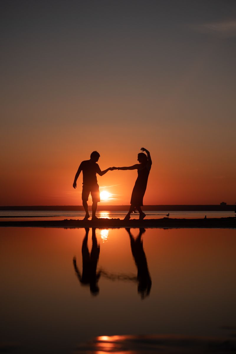 Couple dancing at sunset
