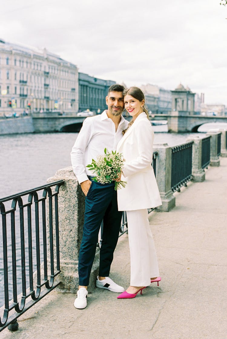 Couple Standing Close Each Other On Promenade On River In Old Town