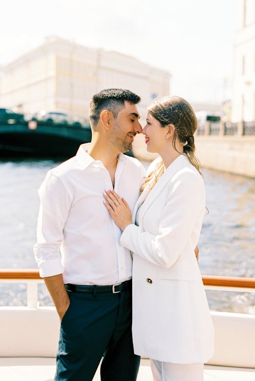 Couple Standing Face to Face and Touching Each Other with Noses