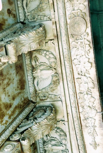 Close-up of intricate carved architectural design showcasing rich details.