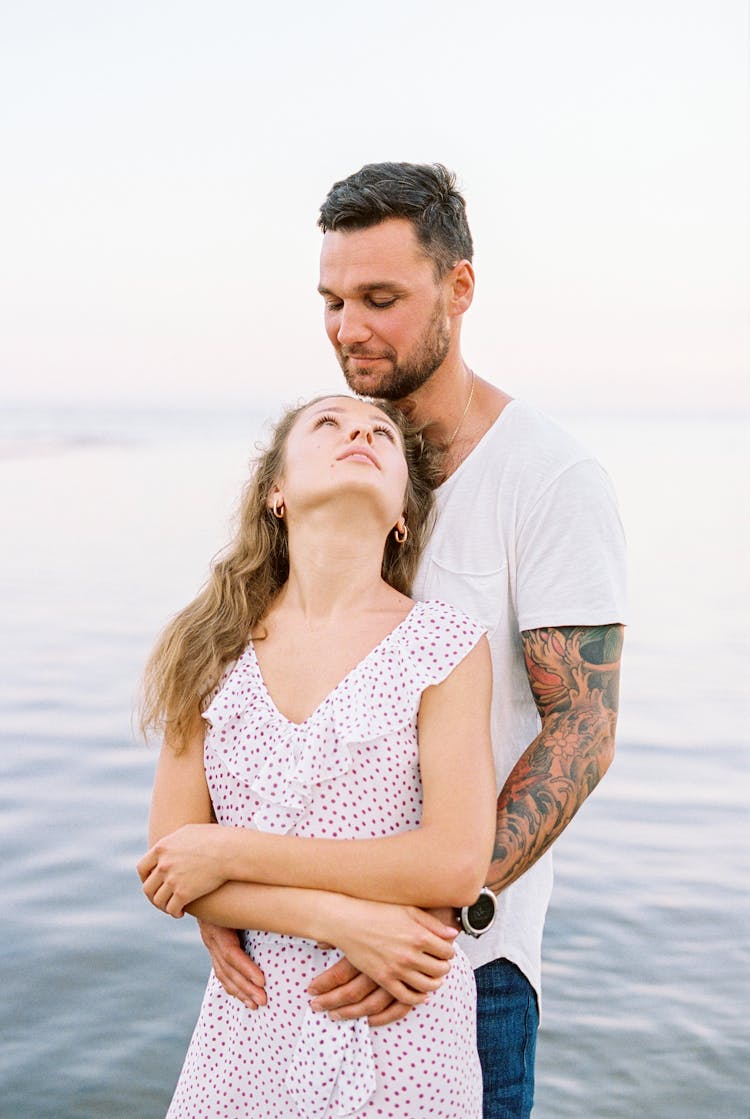 Man Embracing Woman From Behind 