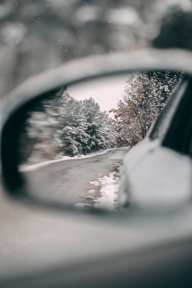 Winter Road Reflected In Car Mirror