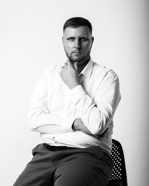 Free Grayscale Photo of a Man in a Dress Shirt and Pants Stock Photo