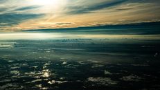 Body of Water Under Cloudy Sky during Sunset