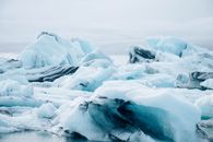 Ice Covered Rocks on Snow Covered Ground