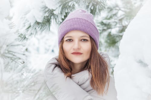 Free Woman in White Jacket and Purple Knit Cap Stock Photo