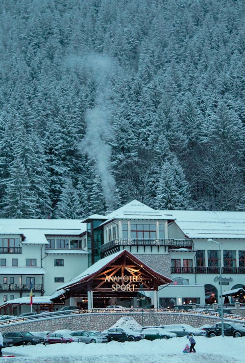 Free A Hotel with Snow Covered Trees at the Back Stock Photo