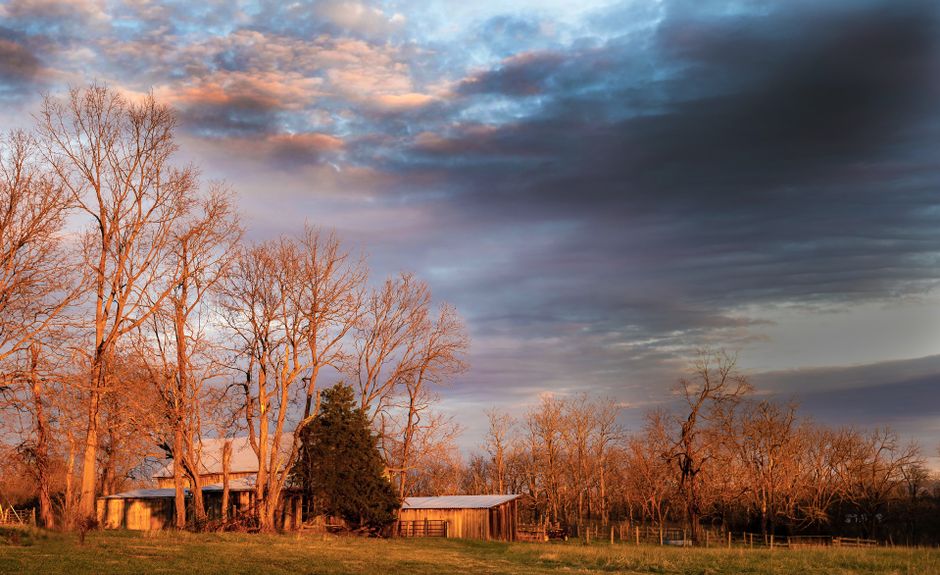 Discover serenity in a rural autumn landscape showcasing a wooden cabin at sunset. Discover serenity in a rural autumn landscape showcasing a wooden cabin at sunset.