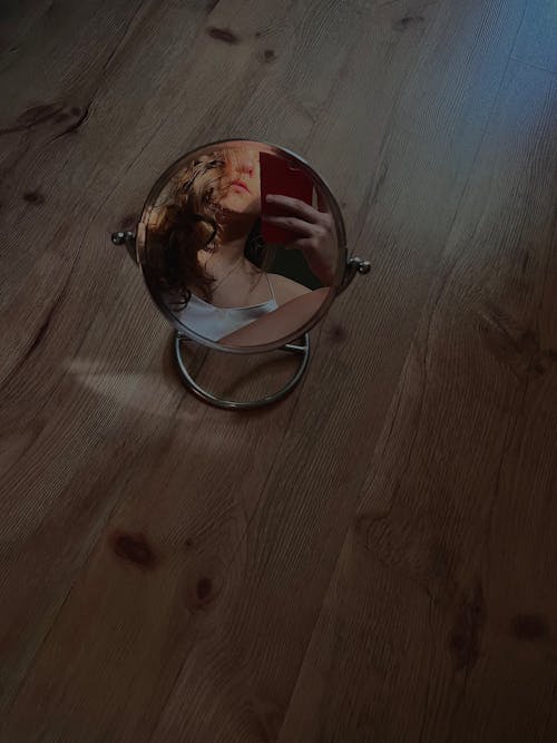 A Mirror on a Wooden Floor