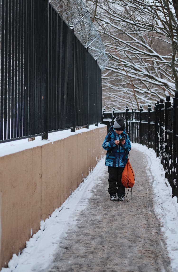 Boy Walking Path On Winter Day