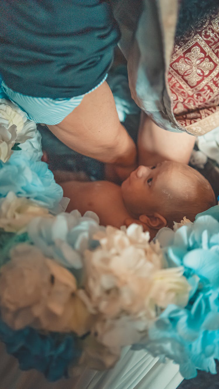 A Baby And Flowers