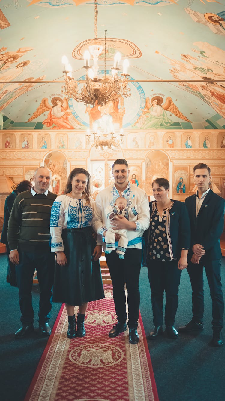 A Group Of People Standing Inside The Church