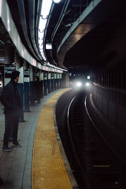 Commuters Waiting on a Train Station