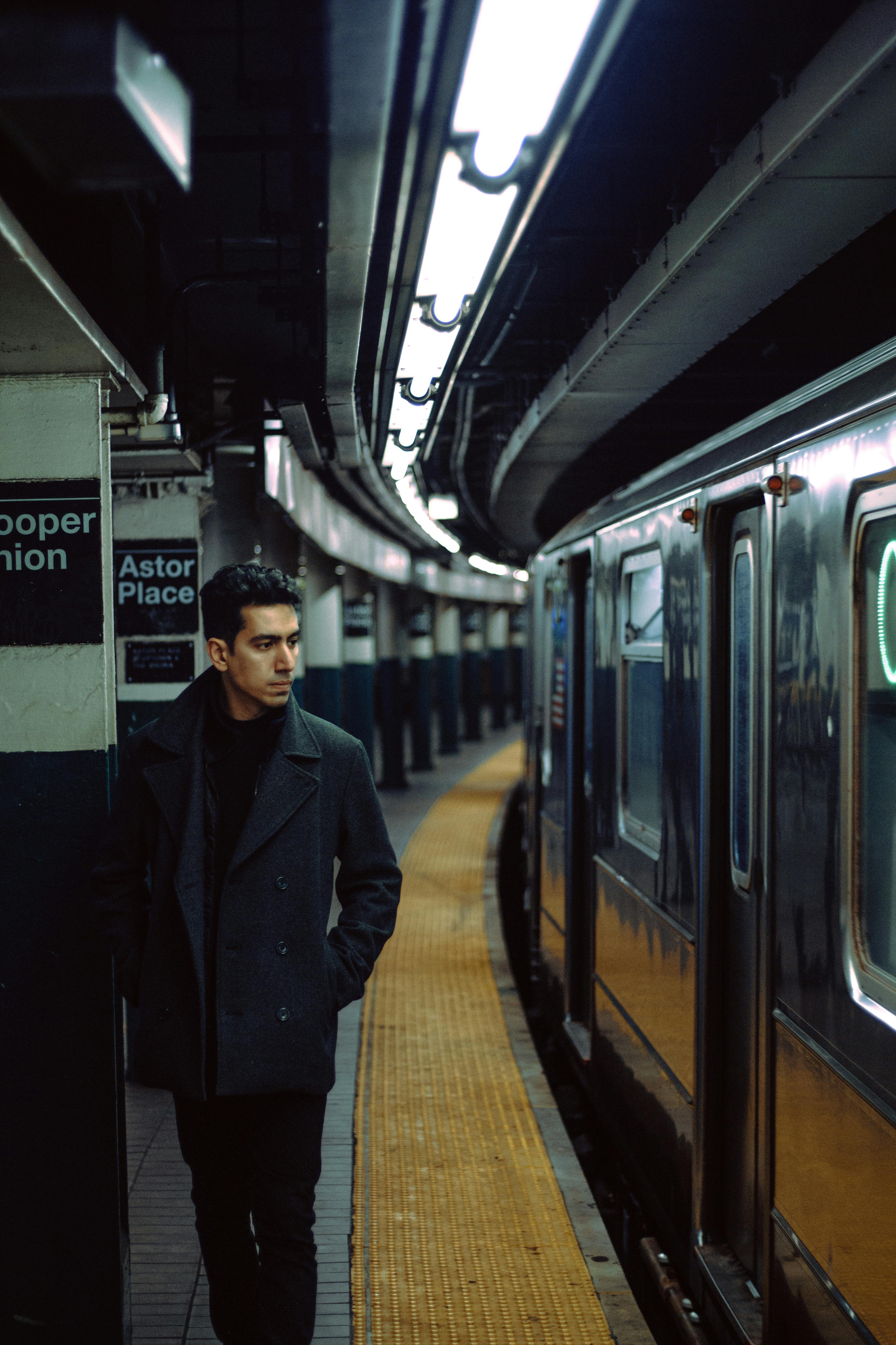 Man Taking a Picture in a Traffic Mirror at a Subway Station · Free Stock  Photo