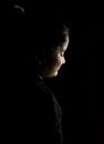 Boy in Black Hoodie Looking Down