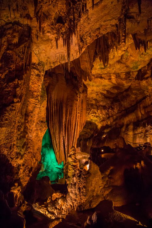 Free Explore the beauty of a limestone cave showcasing stunning stalactites and stalagmites formations. Stock Photo