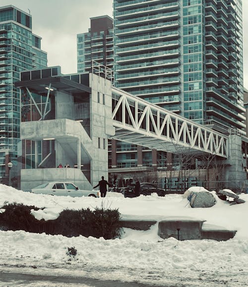 White Snow Covered Ground Near Modern Building