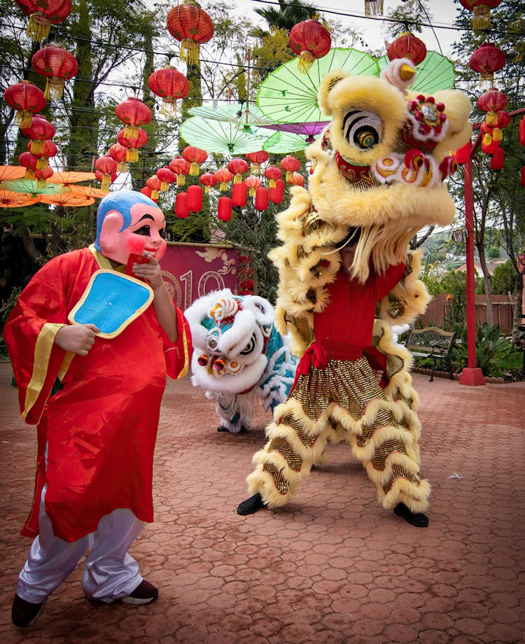 People Inside A Chinese Dragon Costume