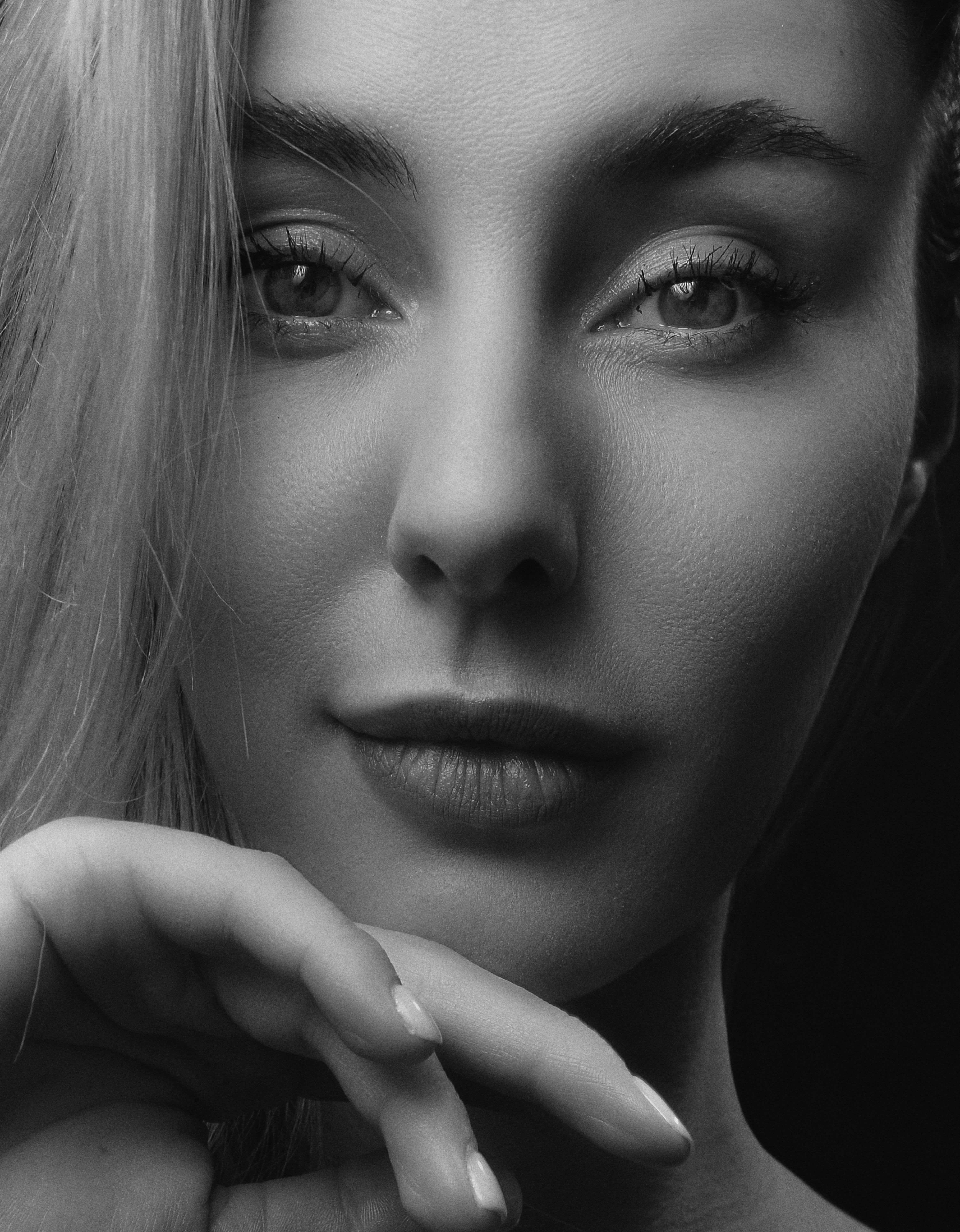 Artistic black and white close-up portrait capturing serene elegance.