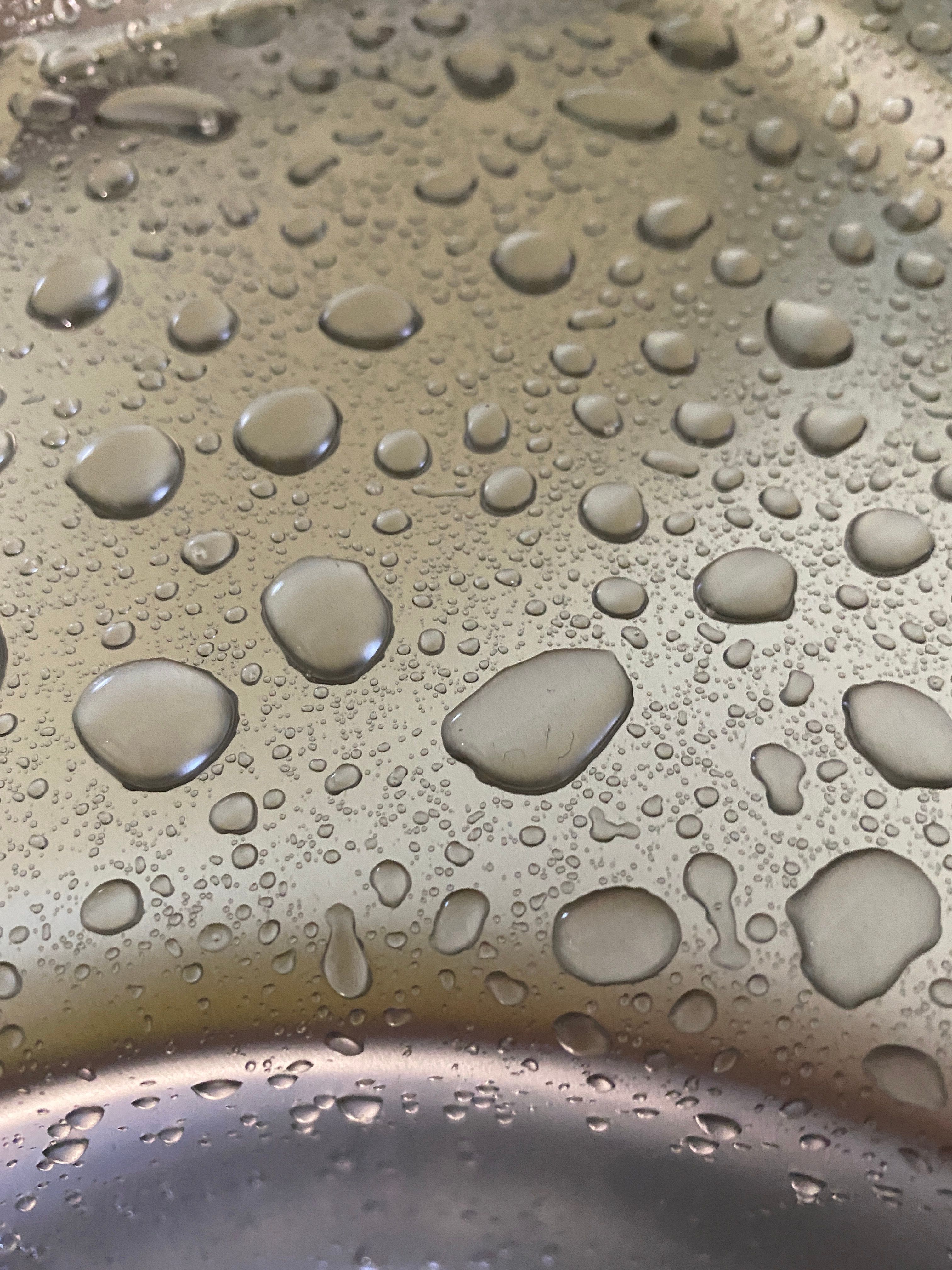 Close-Up Shot of Water Drops on a Metal · Free Stock Photo