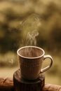 Steaming Mug of Coffee on Wooden Coaster 